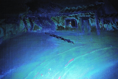 image of a painting under UV light, inpainting glows brightly